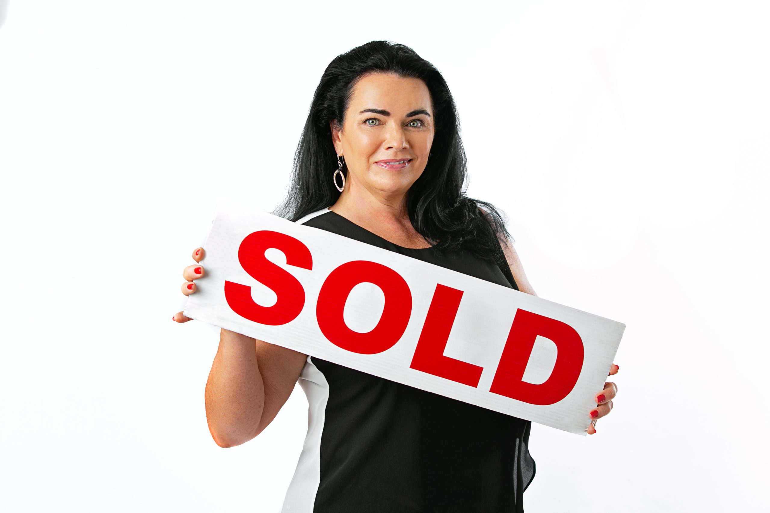 Selling a home Port St Lucie – Realtor holding SOLD sign