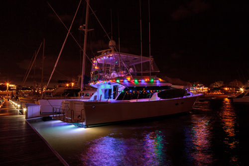 Key West holiday movie towns boat decorated with Christmas lights at night